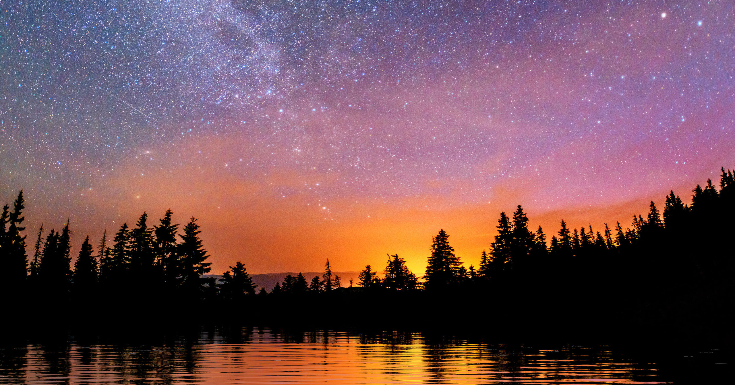 Meteor shower over sunset trees and water October 2022 featured