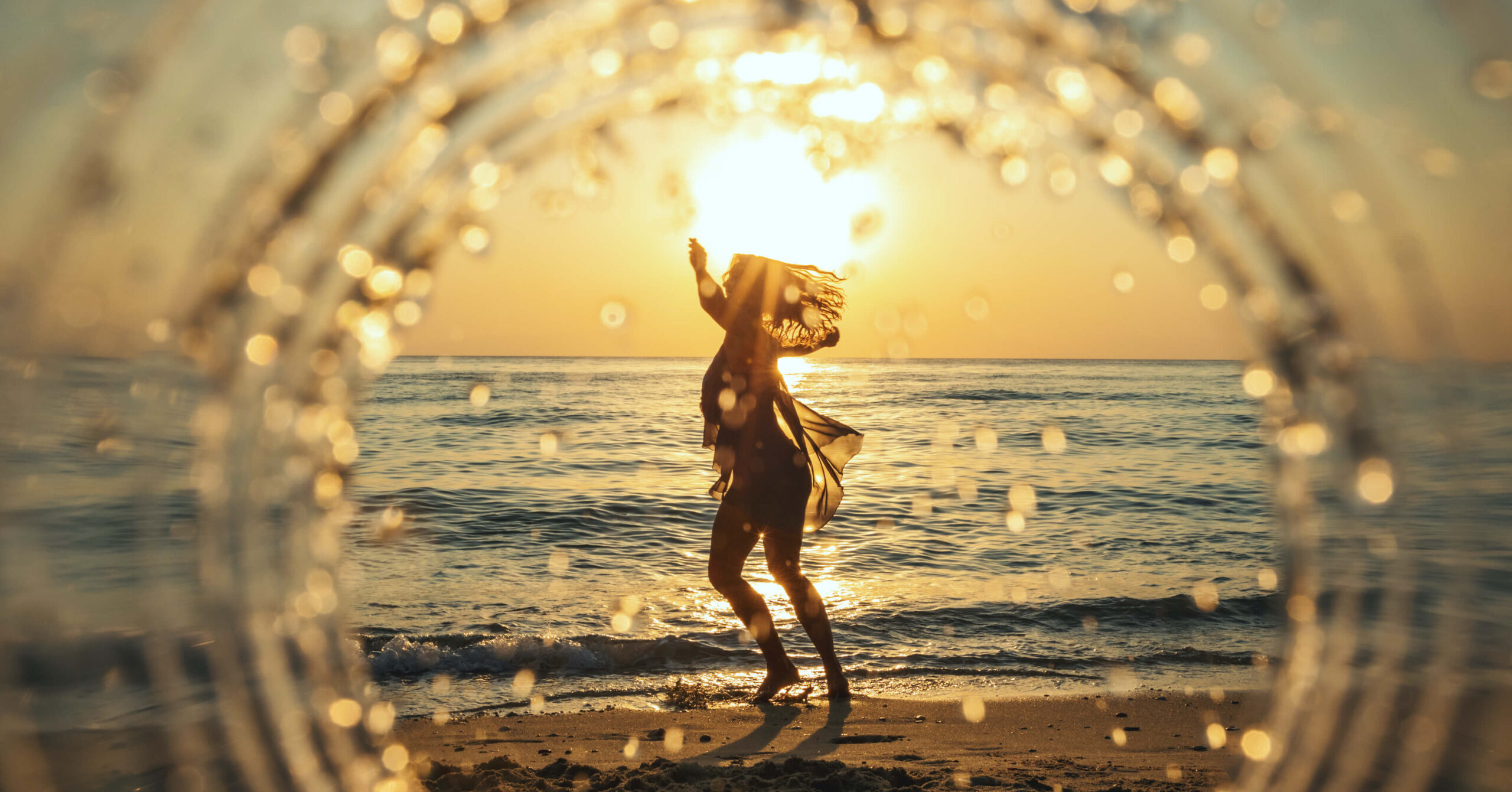 Woman enjoying summer at the beach July 2022 featured