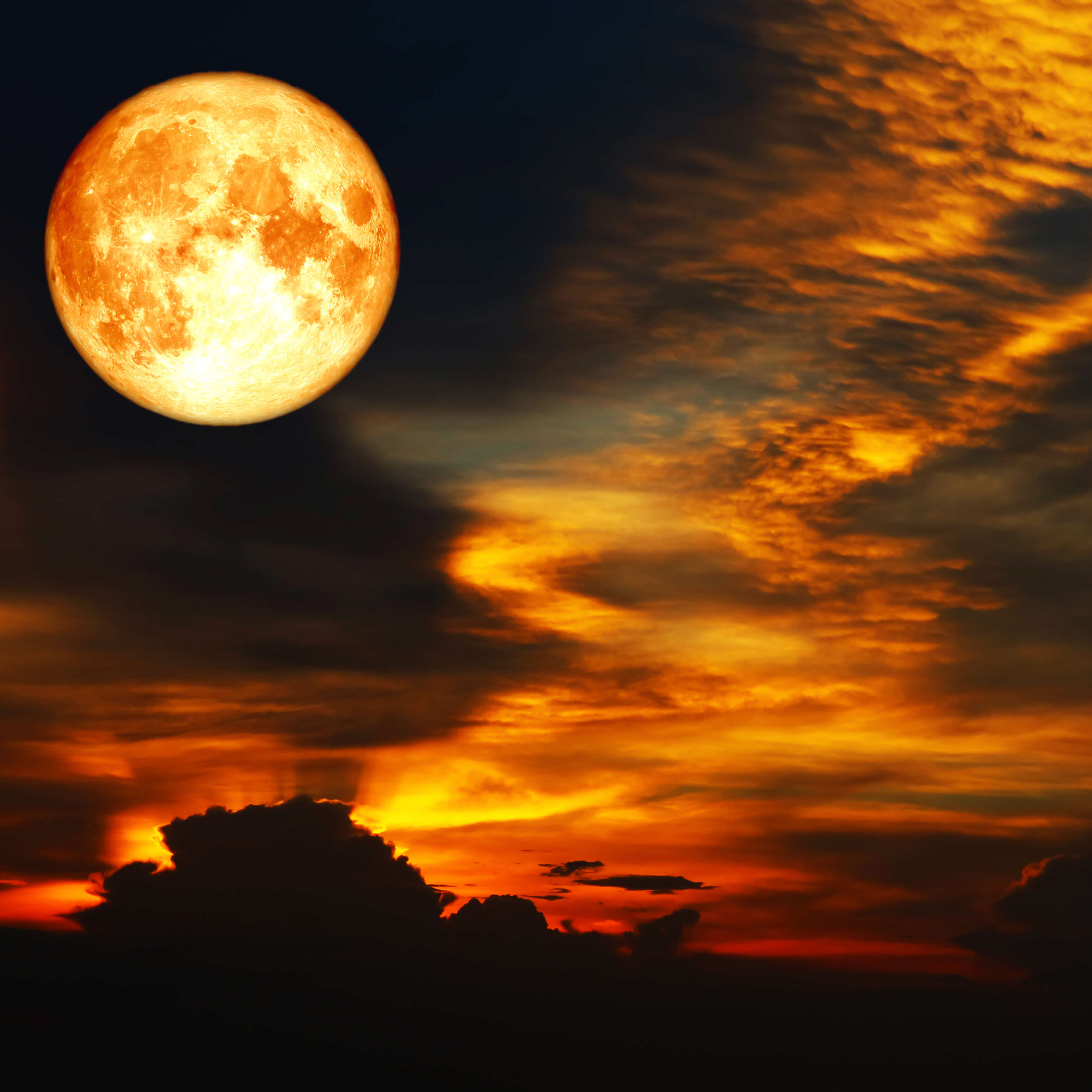 Blood moon with colorful clouds November 2022